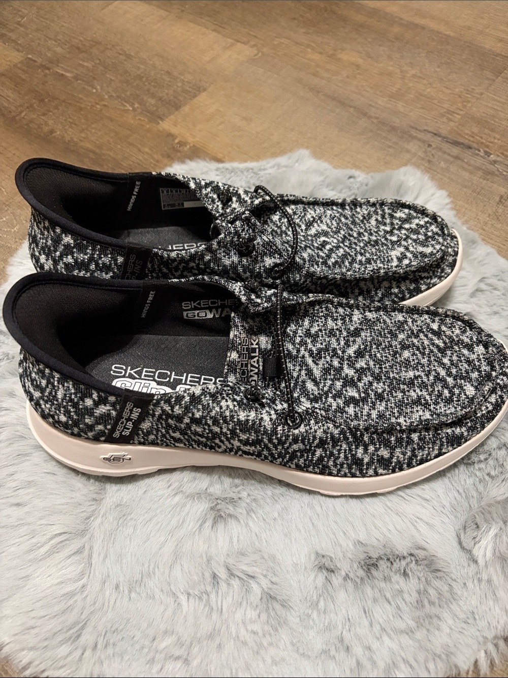 Skechers GO WALK Slip-ins featuring a black and white heathered knit upper. - Picture 2 of 8
